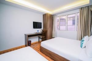 Postel nebo postele na pokoji v ubytování Swing & Pillows - USJ Taipan