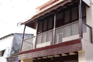 a balcony on the side of a building at Lakshmi Home Stay, Kallidai in Tirunelveli +2 photos
