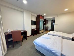 South China Sea Place by Kinabina Homestay客房内的一张或多张床位