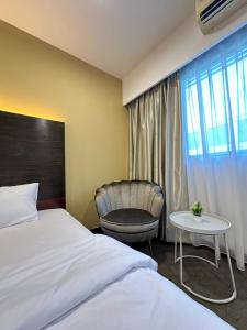 South China Sea Place by Kinabina Homestay客房内的一张或多张床位