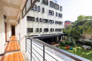 an external view of a building with a balcony at Penpark Place in Bangkok