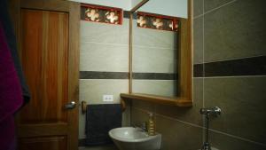 a bathroom with a sink and a mirror at Donde Andres en la Playa in Necoclí +38 photos