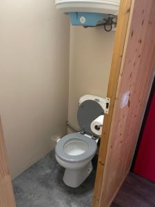 a bathroom with a toilet and a sink at Appartement de montagne in Prémanon