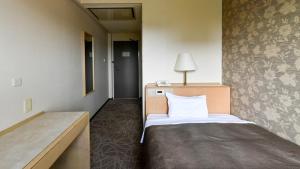 Letto o letti in una camera di Okazaki Daiichi Hotel