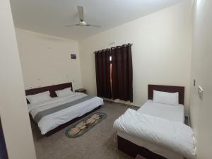 Ένα ή περισσότερα κρεβάτια σε δωμάτιο στο Vasudev Homestay +7 φωτογραφίες