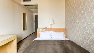 Letto o letti in una camera di Okazaki Daiichi Hotel