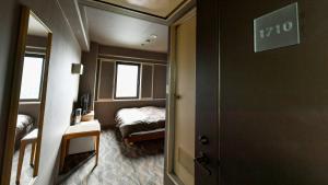 Letto o letti in una camera di Okazaki Daiichi Hotel