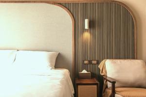 Posteľ alebo postele v izbe v ubytovaní Yuzhi Wenlv B&B