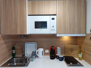 A kitchen or kitchenette at Casa del Mar Air-conditioned Apartment with Swimming Pools - Corralejo Playa