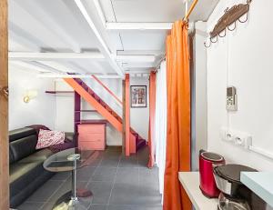 Posezení v ubytování Chez Jeanine - Studio avec Wifi et Climatisation