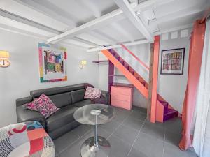 Posezení v ubytování Chez Jeanine - Studio avec Wifi et Climatisation