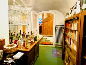 a room with a green floor with bottles on a counter at Mariazeller Resort Landliebe in Mariazell
