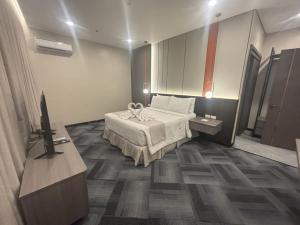 Postel nebo postele na pokoji v ubytování ILOILO GRAND HOTEL