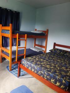 Postel nebo postele na pokoji v ubytování Vida Linda Hostel