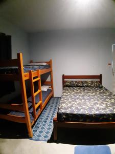 Postel nebo postele na pokoji v ubytování Vida Linda Hostel + 13 fotografií