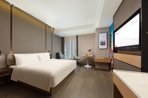 Postel nebo postele na pokoji v ubytování Atour Hotel Xiamen Wuyuanwan Wanda Plaza