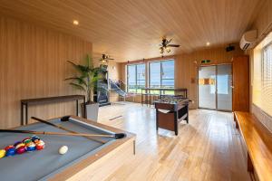 a billiard room with a pool table in it at The BONDS SPAオーシャンプライベートヴィラー千葉白浜ー in Minamiboso