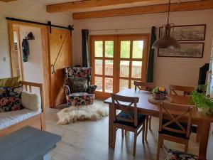 a living room with a table and chairs at U Sofie in Bublava