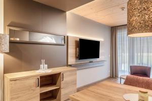 Μια τηλεόραση ή/και κέντρο ψυχαγωγίας στο Hotel zum Schwanen - Appartement 2
