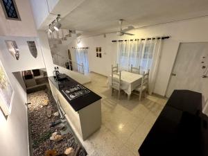 an overhead view of a kitchen with a stove and a table at Eden villa colombo in Kirillapone +10 photos