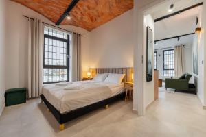 En eller flere senge i et værelse på Apartamenty Grossa - Dream Apart