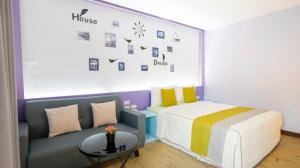 Rúm í herbergi á Ocean Star B&B