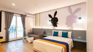 Rúm í herbergi á Ocean Star B&B