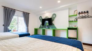 Rúm í herbergi á Ocean Star B&B