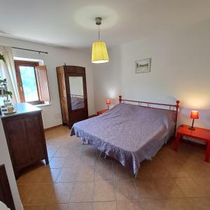 Postel nebo postele na pokoji v ubytování Appartamenti Il Capomandro