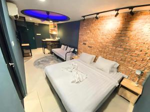 Letto o letti in una camera di Smile Hotel Chow Kit PWTC