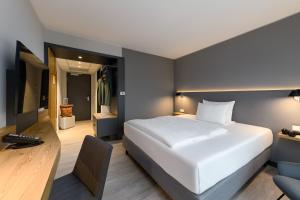 Maxx Hotel Aalen客房内的一张或多张床位