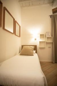 Postel nebo postele na pokoji v ubytování Hotel Bencidormi