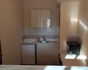 Kuchyň nebo kuchyňský kout v ubytování Annaliza Apartments
