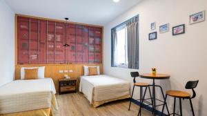 Rúm í herbergi á Ocean Star B&B
