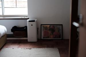 Postel nebo postele na pokoji v ubytování 佐藤理容Inn + 7 fotografií
