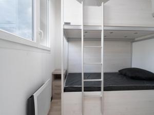 a small bedroom with a bed and a book shelf at La Dune N 59 - Villa 3P6 in Sérignan +13 photos