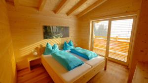 a bedroom with a bed in a log cabin at Ferienwohnung Zillertal - Schwemberger in Fügen