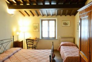 Postel nebo postele na pokoji v ubytování B&B La corte di Stelio