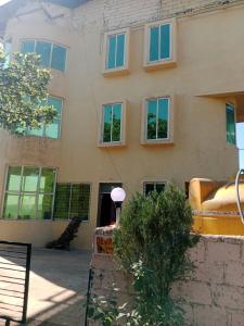 a building with a couch on the side of it at Dev anand Villa in Mahabaleshwar