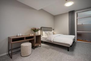 Voodi või voodid majutusasutuse Enter Skansen Hotel toas