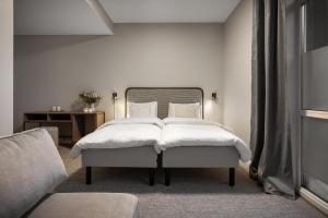 Voodi või voodid majutusasutuse Enter Skansen Hotel toas