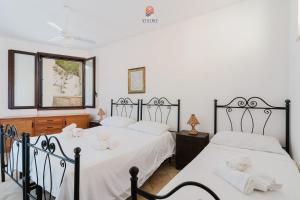 Postel nebo postele na pokoji v ubytování Dimora Rustica by Vivimy