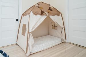 a bed in a tent in a room at 76-2 5BR Cozy Apartment in Boston in Boston