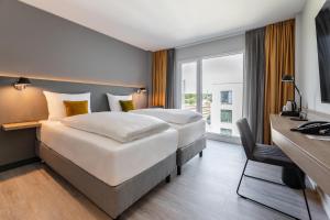 Maxx Hotel Aalen客房内的一张或多张床位