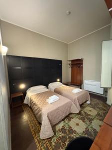 Postel nebo postele na pokoji v ubytování Santuzza Art Hotel Catania