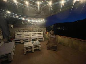 a room with benches and lights on a roof at Loft avec Sauna et Jacuzzi in Solliès-Pont