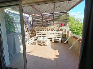 a view of a patio from a sliding glass door at Loft avec Sauna et Jacuzzi in Solliès-Pont