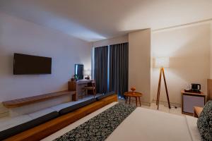 TV a/nebo společenská místnost v ubytování Tusita Boutique Hotel