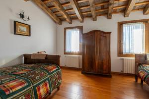 Posteľ alebo postele v izbe v ubytovaní Holiday House Petrarca