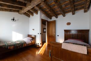 Posteľ alebo postele v izbe v ubytovaní Holiday House Petrarca